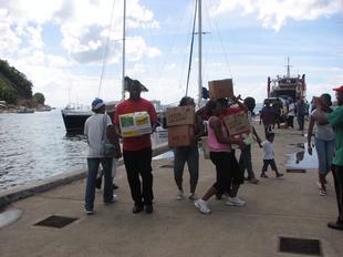 Image #26 - Hurricane Tomas Relief Effort (Carrying the goods to the distribution point)